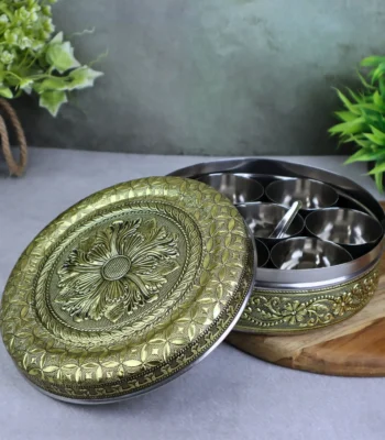 Flower Embossed Masala Dani with 7 containers and spoon in stainless steel. Meenakari spice box organiser for daily cooking and return gifting.